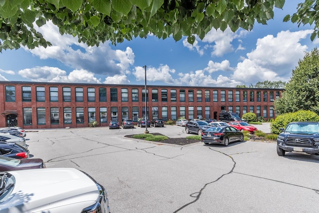 30 Lincoln St Unit 109, Westbrook, ME 04092 - view of building exterior featuring uncovered parking