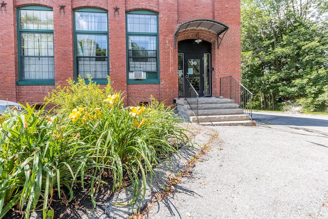 30 Lincoln St Unit 109, Westbrook, ME 04092 - entrance to property featuring brick siding and cooling unit