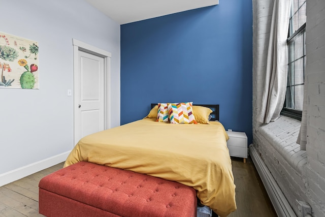 30 Lincoln St Unit 109, Westbrook, ME 04092 - bedroom with wood finished floors and baseboards