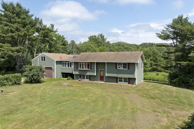 474 Center St, Nobleboro, ME 04555 - raised ranch featuring a front lawn, a garage, a chimney, and a shingled roof