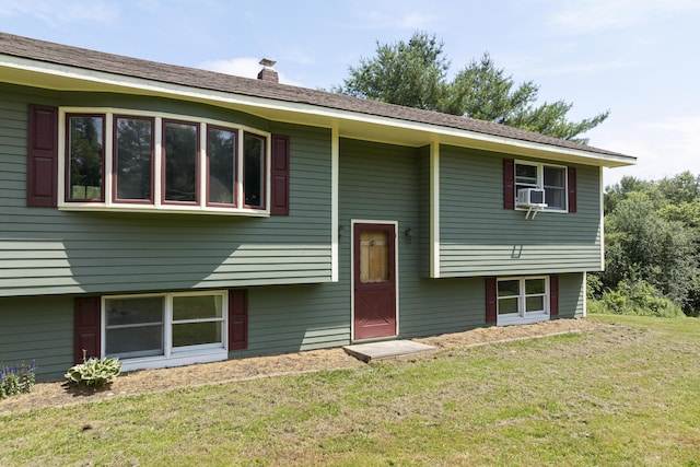 474 Center St, Nobleboro, ME 04555 - split foyer home with a chimney, a front yard, and cooling unit