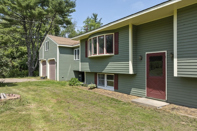 474 Center St, Nobleboro, ME 04555 - rear view of property with a yard and a garage