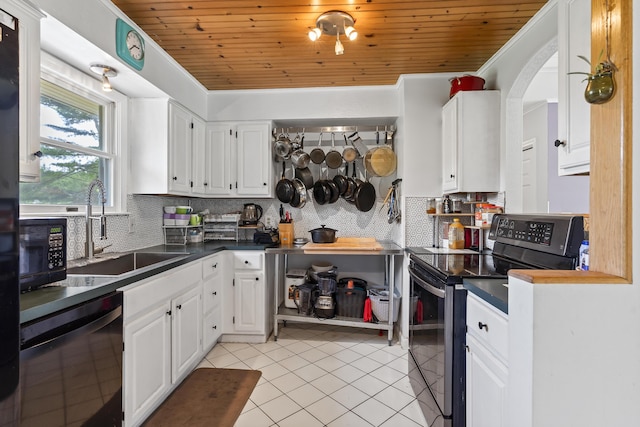 474 Center St, Nobleboro, ME 04555 - kitchen featuring stainless steel appliances, light tile patterned flooring, white cabinetry, wood ceiling, and dark countertops