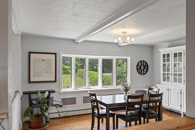 474 Center St, Nobleboro, ME 04555 - dining area featuring light wood-type flooring, a chandelier, beamed ceiling, crown molding, and a textured ceiling
