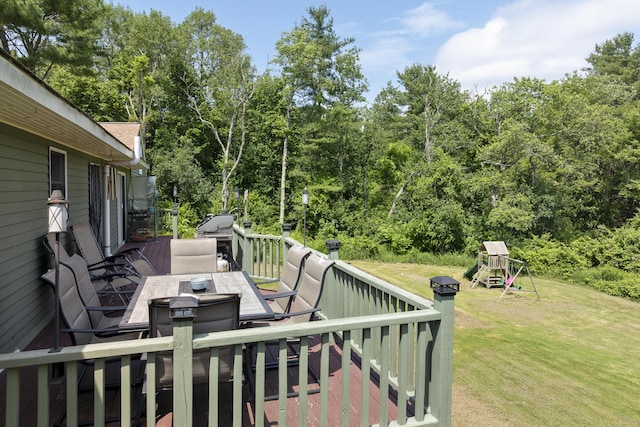 474 Center St, Nobleboro, ME 04555 - wooden deck featuring a yard, a playground, outdoor dining area, area for grilling, and view of wooded area