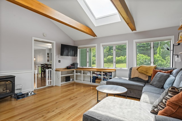 474 Center St, Nobleboro, ME 04555 - living room with a skylight, light wood-type flooring, and a wood stove