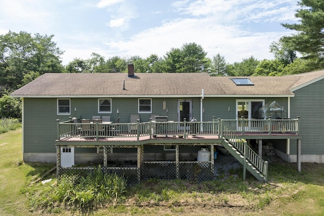 474 Center St, Nobleboro, ME 04555 - back of property featuring a wooden deck, stairway, a chimney, and a shingled roof
