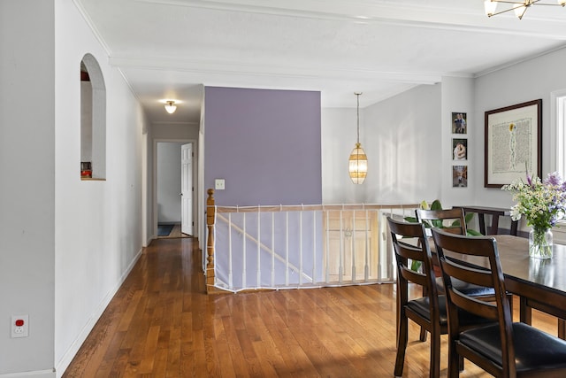 474 Center St, Nobleboro, ME 04555 - dining room featuring wood-type flooring, ornamental molding, arched walkways, and a chandelier