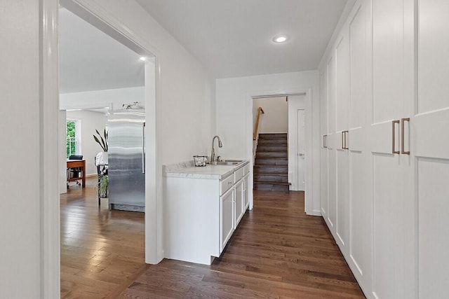 43 Brookside Ln, Freeman Twp, ME 04983 - corridor with dark wood finished floors, stairs, and recessed lighting