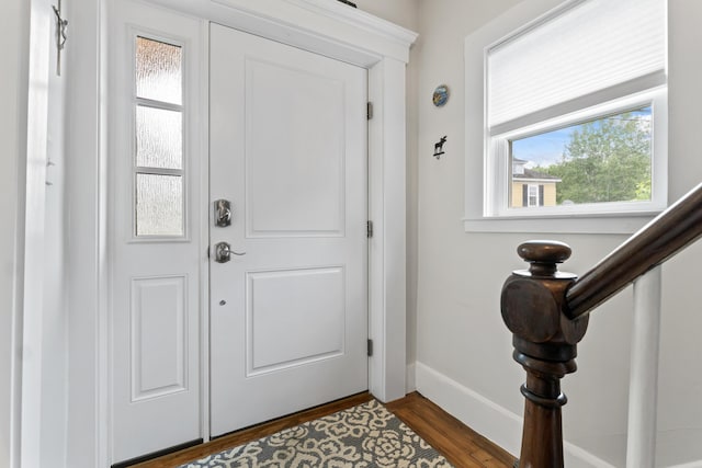223 Centre St, Bath, ME 04530 - foyer featuring dark wood-type flooring and baseboards