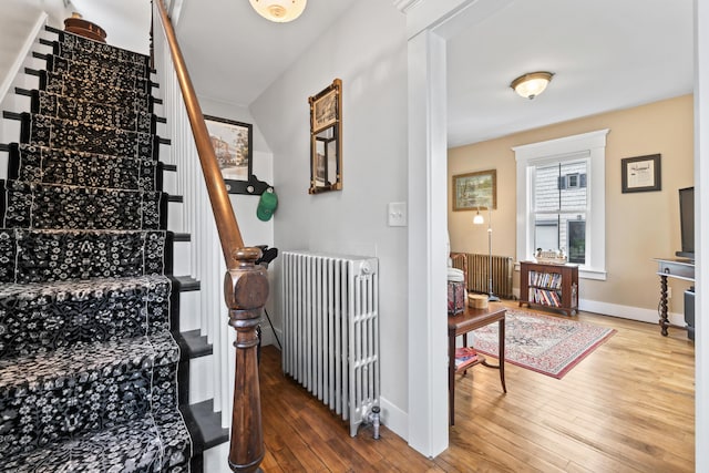 223 Centre St, Bath, ME 04530 - stairway featuring radiator and hardwood / wood-style flooring