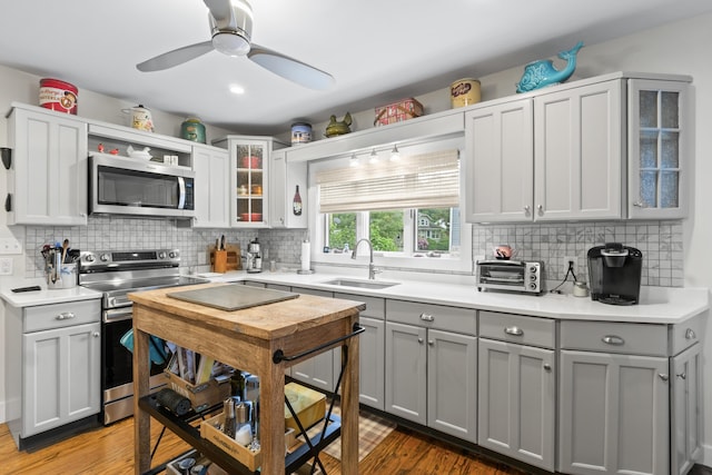 223 Centre St, Bath, ME 04530 - kitchen featuring appliances with stainless steel finishes, gray cabinets, light countertops, and tasteful backsplash