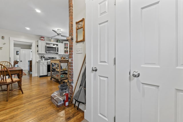 223 Centre St, Bath, ME 04530 - hallway with light wood-style flooring and recessed lighting
