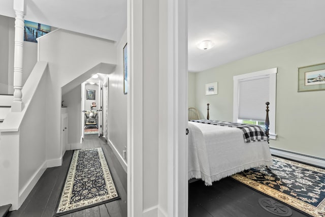 223 Centre St, Bath, ME 04530 - corridor with a baseboard heating unit and dark wood-style floors