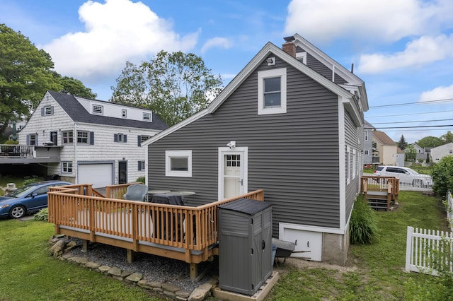 223 Centre St, Bath, ME 04530 - back of house with a garage, a deck, a lawn, and a chimney