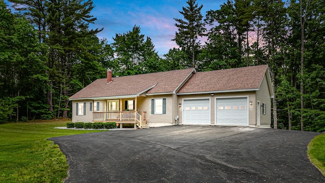 5 Willard Way, Raymond, ME 04071 - single story home with a garage, driveway, a chimney, a yard, and a shingled roof
