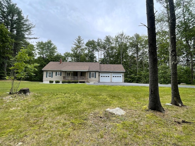 5 Willard Way, Raymond, ME 04071 - single story home featuring a garage, covered porch, driveway, a front yard, and a chimney