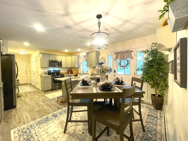 5 Willard Way, Raymond, ME 04071 - dining space with light wood-type flooring, a chandelier, and recessed lighting
