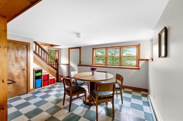 302 Spring St, Brownfield, ME 04010 - dining area featuring tile patterned floors, stairs, and baseboard heating