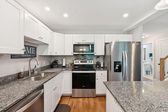 13 Junco Dr Unit 6, Windham, ME 04062 - kitchen featuring stainless steel appliances, white cabinetry, stone counters, recessed lighting, and light wood-style flooring