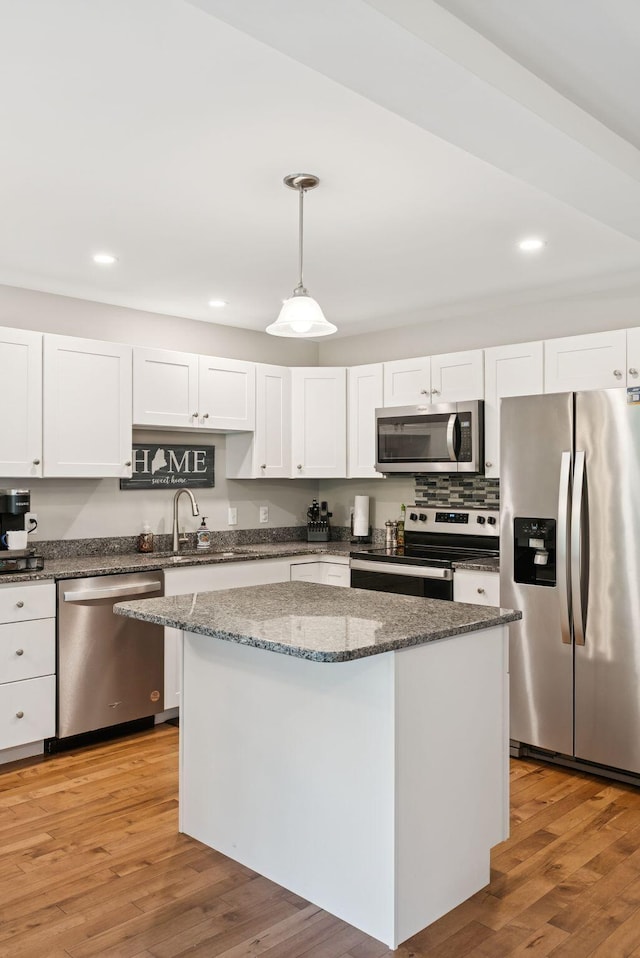 13 Junco Dr Unit 6, Windham, ME 04062 - kitchen featuring appliances with stainless steel finishes, a center island, white cabinetry, decorative light fixtures, and recessed lighting