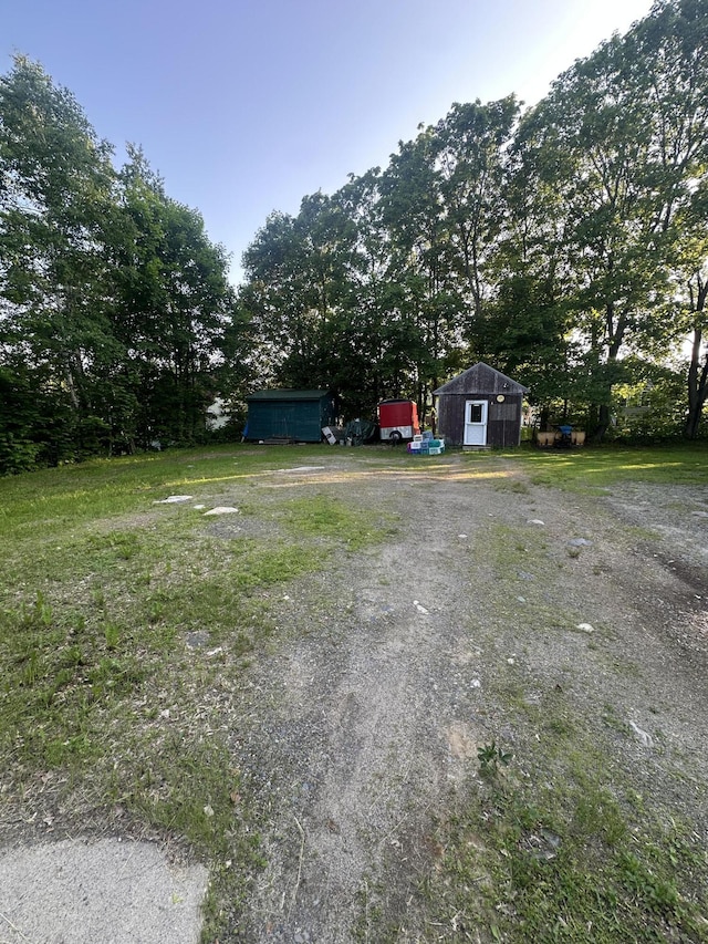 8 Lincoln St, Millinocket, ME 04462 - view of yard with an outbuilding and a garage