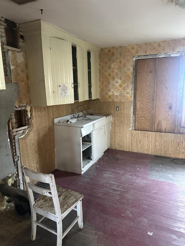 8 Lincoln St, Millinocket, ME 04462 - kitchen featuring wallpapered walls, wooden walls, and hardwood / wood-style flooring