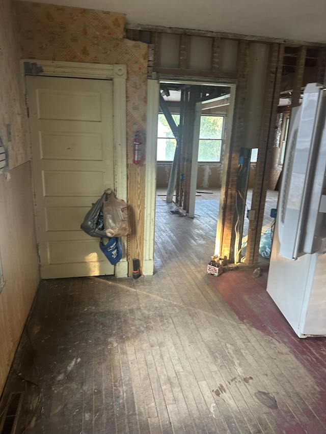 8 Lincoln St, Millinocket, ME 04462 - corridor with wood-type flooring and wallpapered walls