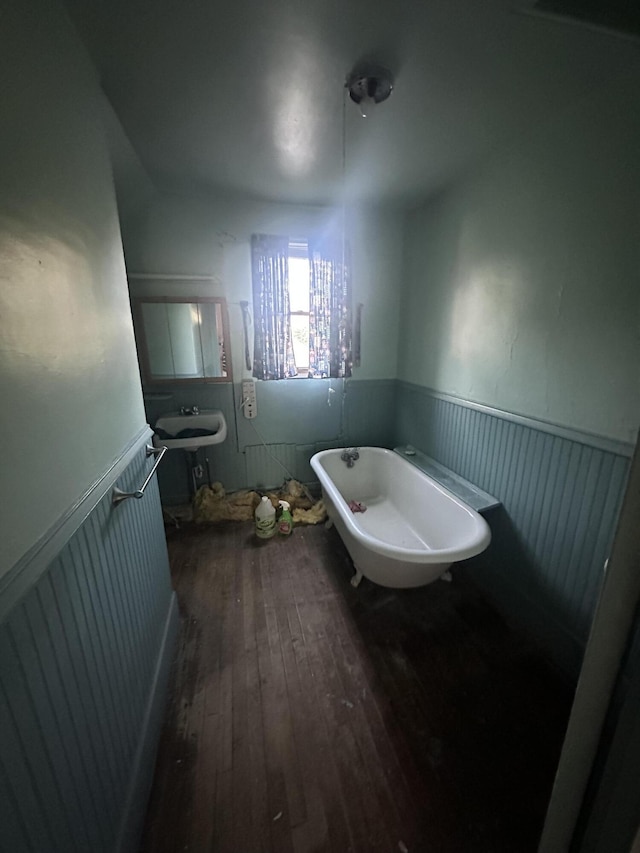 8 Lincoln St, Millinocket, ME 04462 - bathroom with wainscoting, hardwood / wood-style floors, and a freestanding bath
