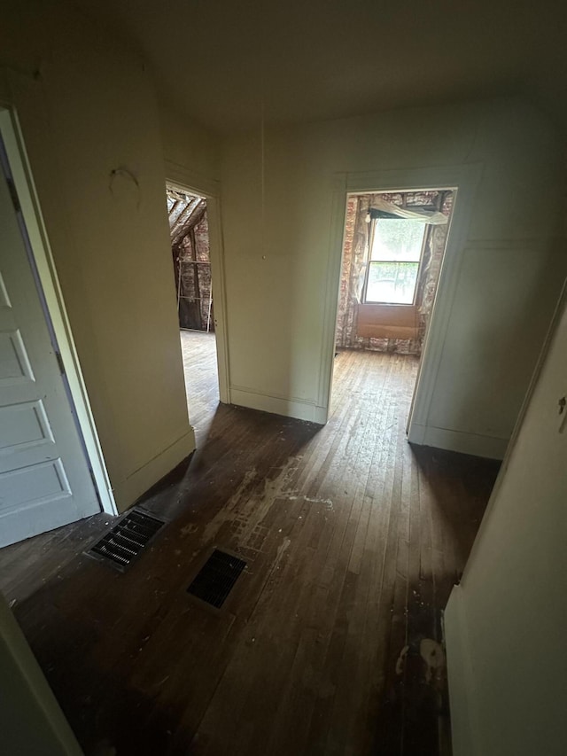 8 Lincoln St, Millinocket, ME 04462 - hallway with dark wood finished floors