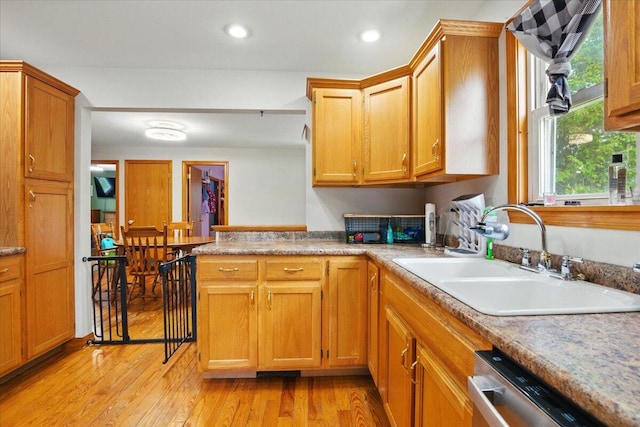 5 Jeffrey St, Lewiston, ME 04240 - kitchen with dishwasher, light wood-style flooring, brown cabinets, recessed lighting, and light countertops