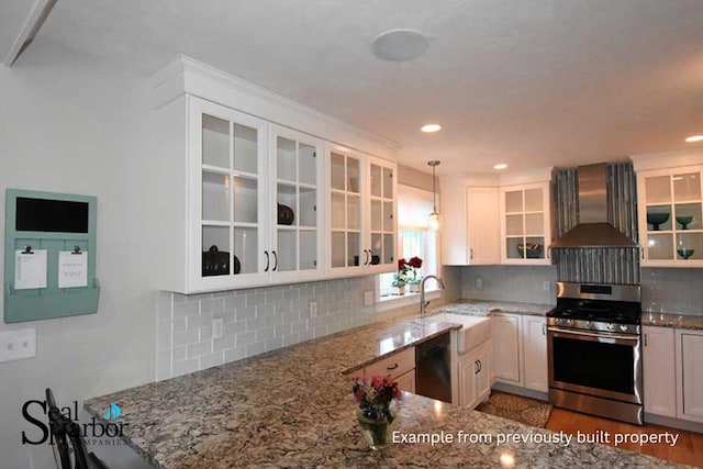 11 Clam Ln Unit B, Wells, ME 04090 - kitchen with stainless steel gas stove, dishwasher, wall chimney exhaust hood, light stone counters, and pendant lighting