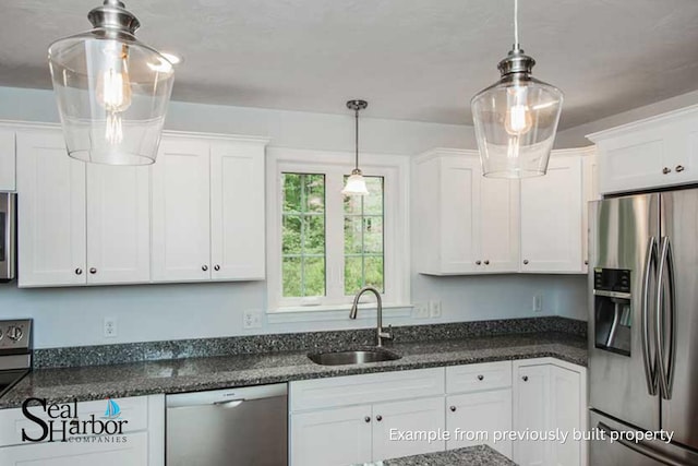 11 Clam Ln Unit B, Wells, ME 04090 - kitchen featuring stainless steel appliances, white cabinets, pendant lighting, and dark stone countertops