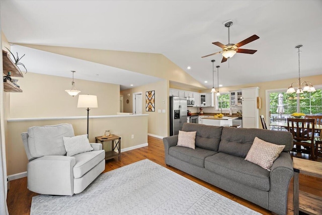 22 Fox Run Rd, Gray, ME 04039 - living room featuring vaulted ceiling, ceiling fan, wood finished floors, recessed lighting, and a chandelier