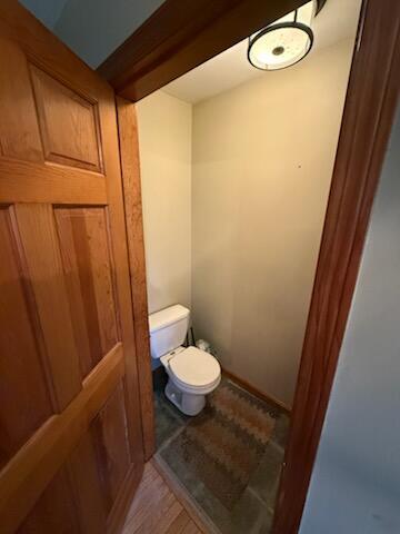 396 E Ridge Rd, Mars Hill, ME 04758 - bathroom featuring toilet and wood finished floors