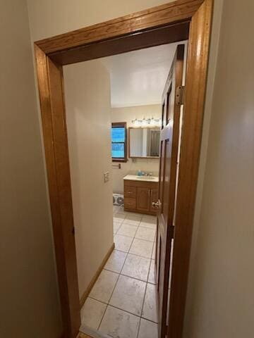 396 E Ridge Rd, Mars Hill, ME 04758 - corridor featuring light tile patterned floors