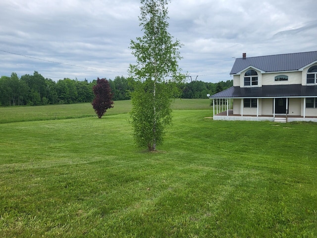 396 E Ridge Rd, Mars Hill, ME 04758 - view of green lawn featuring a porch