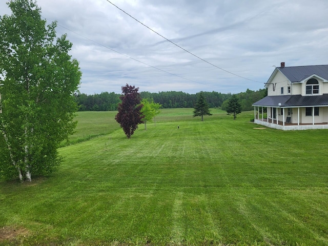 396 E Ridge Rd, Mars Hill, ME 04758 - view of grassy yard with covered porch