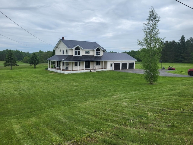 396 E Ridge Rd, Mars Hill, ME 04758 - country-style home with a porch, asphalt driveway, a garage, and a front lawn