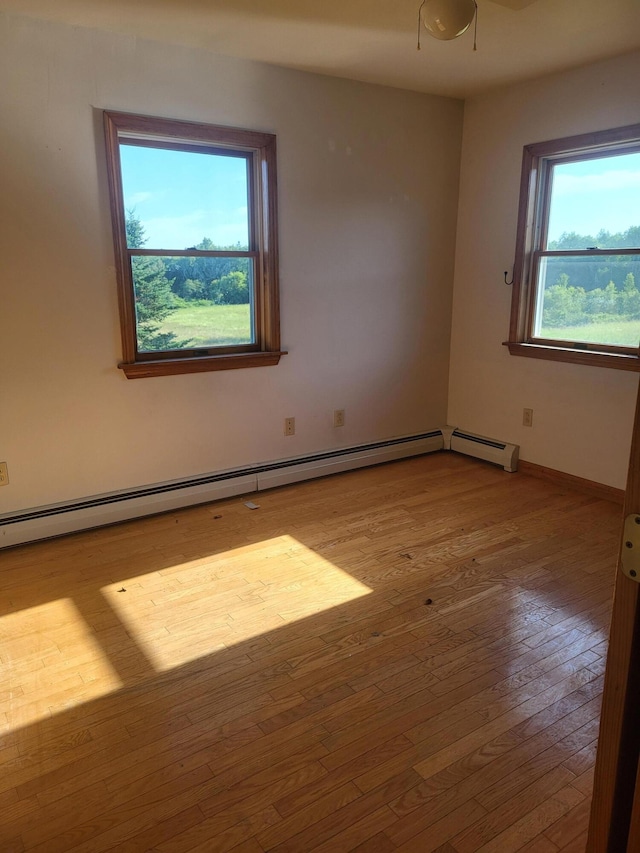 396 E Ridge Rd, Mars Hill, ME 04758 - empty room featuring hardwood / wood-style flooring and baseboard heating