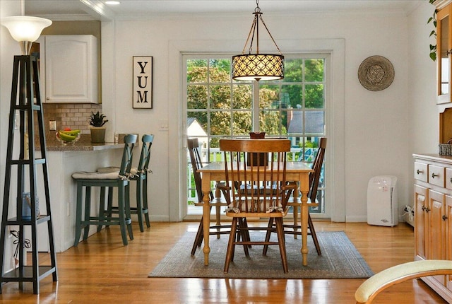 4 Hawthorne Pl, Lewiston, ME 04240 - dining room with ornamental molding and light wood-type flooring