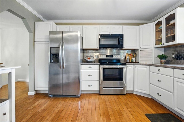 4 Hawthorne Pl, Lewiston, ME 04240 - kitchen with appliances with stainless steel finishes, light wood-type flooring, white cabinets, glass insert cabinets, and decorative backsplash