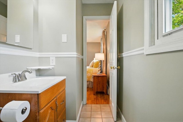 4 Hawthorne Pl, Lewiston, ME 04240 - ensuite bathroom with vanity and tile patterned flooring
