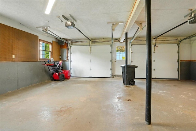 4 Hawthorne Pl, Lewiston, ME 04240 - garage featuring a garage door opener and electric panel