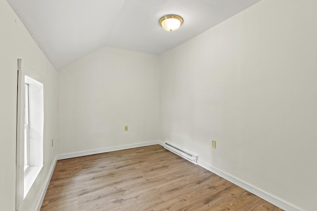 200 Main St, Freeport, ME 04032 - bonus room with a baseboard heating unit, lofted ceiling, and light wood-style flooring