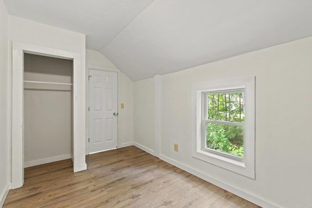 200 Main St, Freeport, ME 04032 - unfurnished bedroom featuring lofted ceiling, light wood finished floors, and a closet
