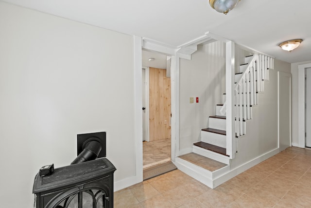 200 Main St, Freeport, ME 04032 - stairs featuring a wood stove and tile patterned floors