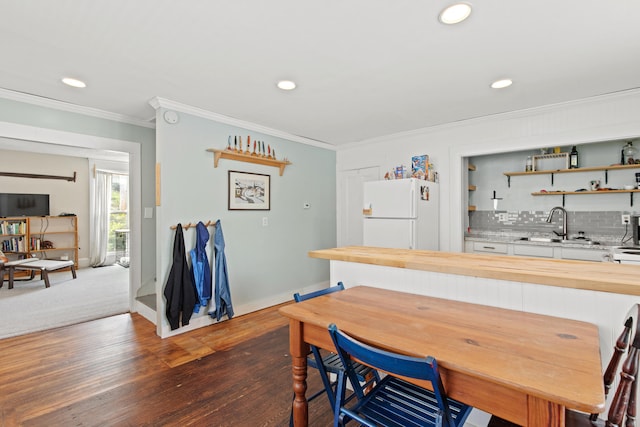 200 Main St, Freeport, ME 04032 - dining space with crown molding, recessed lighting, dark wood-style floors, and wet bar