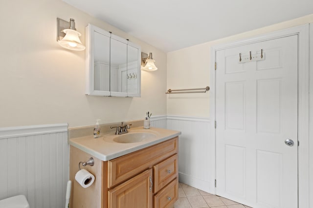 200 Main St, Freeport, ME 04032 - bathroom featuring vanity, a wainscoted wall, and tile patterned flooring