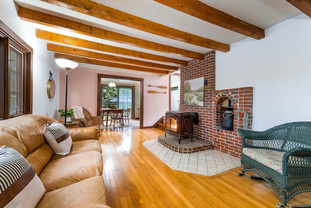 385 Sabbathday Rd, New Gloucester, ME 04260 - living area with beam ceiling, hardwood / wood-style floors, and a wood stove
